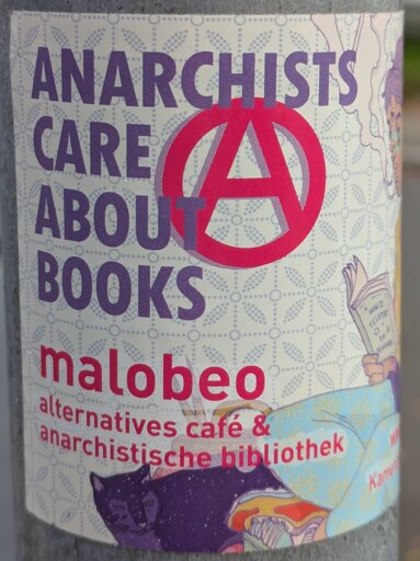 Sticker with an anarchy A and the text "ANARCHISTS CARE ABOUT BOOKS" and promiting info shop malobeo